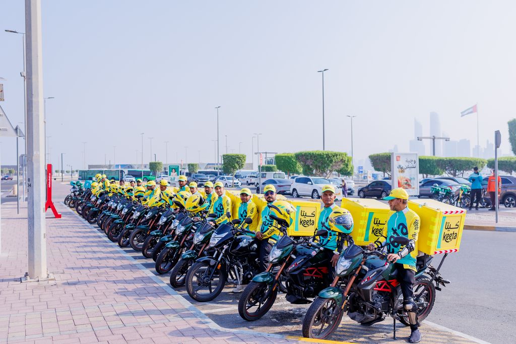 A fleet of YaBalash delivery motorcycles lined up in Abu Dhabi.